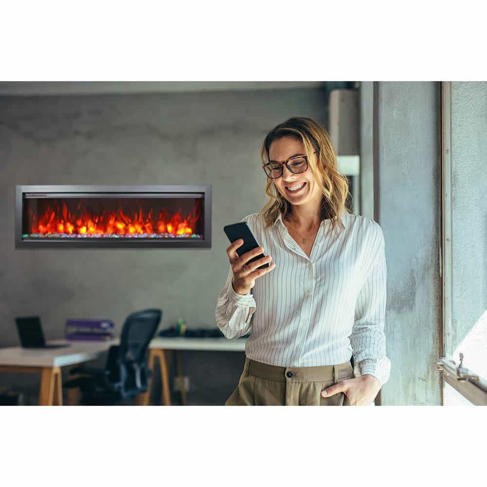 Smiling businesswoman using phone in office
